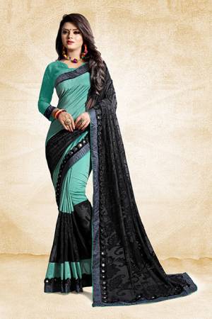 Get Ready For The Next Party At Your Place With This Designer Saree In Sea Green And Black Color Paired With Sea Green Colored Blouse. This Saree Is Fabricated On Art Silk And Brasso Paired With Art Silk Fabricated Blouse. Its Unique Pattern Will Earn You Lots Of Compliments From Onlookers. 