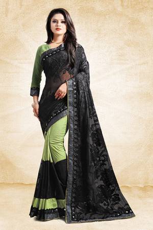 Get Ready For The Next Party At Your Place With This Designer Saree In Light Green And Black Color Paired With Light Green Colored Blouse. This Saree Is Fabricated On Art Silk And Brasso Paired With Art Silk Fabricated Blouse. Its Unique Pattern Will Earn You Lots Of Compliments From Onlookers. 