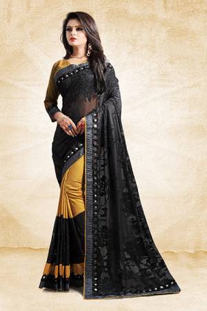 Get Ready For The Next Party At Your Place With This Designer Saree In Musturd Yellow And Black Color Paired With Musturd Yellow Colored Blouse. This Saree Is Fabricated On Art Silk And Brasso Paired With Art Silk Fabricated Blouse. Its Unique Pattern Will Earn You Lots Of Compliments From Onlookers. 