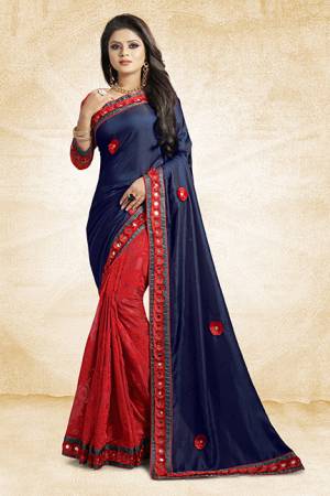 This Festive Season, Look The Most Amazing Of All Wearing This Designer Saree In Navy Blue And Red Color Paired With Red Colored Blouse. This Saree Is Fabricated On Satin Silk And Brasso Paired With Art Silk Fabricated Blouse. Buy Now.