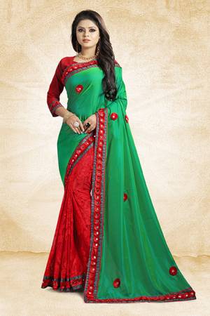 This Festive Season, Look The Most Amazing Of All Wearing This Designer Saree In Green And Red Color Paired With Red Colored Blouse. This Saree Is Fabricated On Satin Silk And Brasso Paired With Art Silk Fabricated Blouse. Buy Now.