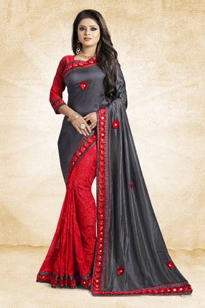 This Festive Season, Look The Most Amazing Of All Wearing This Designer Saree In Grey And Red Color Paired With Red Colored Blouse. This Saree Is Fabricated On Satin Silk And Brasso Paired With Art Silk Fabricated Blouse. Buy Now.
