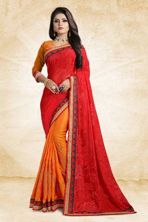 Go Colorful With This Pretty Bright Color Pallete Designer Saree In Red And Orange Color Paired With Orange Colored Blouse. This Saree Is Fabricated On Brasso And Satin Silk Paired With Art Silk Fabricated Blouse. It Has Very Attractive Stone Work Over The Saree Panel. 