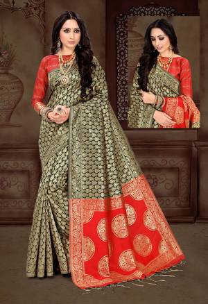 For A Bold And Beautiful Look Grab This Saree In Black Color Paired With Red Colored Blouse. It Is Fabricated On Art Silk Beautified With Attractive And Heavy Weaving All Over It.