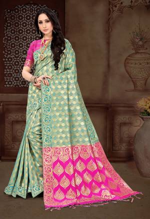 Celebrate This Festive With Beauty And Comfort Draping This Pretty Saree In Light Blue Color Paired With Contrasting Rani Pink Colored Blouse. This Saree And Blouse Are Silk Based Beautified With Heavy Weave, Buy now.