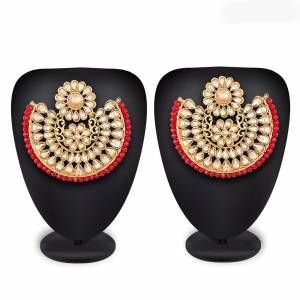 Grab This Beautiful And Attractive Pair Of Heavy Earrings Set In?Golden Color. This Pretty Pair Is Beautified With Stone Work And Can Be Paired With Any Colored Traditional Attire. Buy Now.