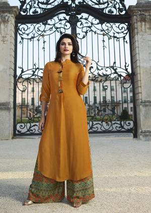 Celebrate This Festive Season Wearing This Designer Readymade Plazzo Set In Musturd Yellow Colored Kurti Paired With Multi Colored Plazzo. This Kurti And Plazzo Are Fabricated On Rayon Beautified With Prints And Thread Work. This Readymade Pair Is Available In All Regular Sizes. Buy Now. 