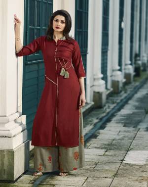 For Your Semi-Casuals Or Festive, Grab This Readymade Pair Of Kurti And Plazzo Fabricated On Rayon. Its Kurti IS In Maroon Color Paired With Grey Colored Printed Plazzo. Its Fabric Is Soft Towards Skin And Easy To Carry All Day Long. 