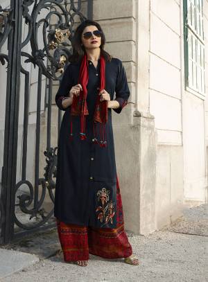 You Will Definitely Earn Lots Of Compliments Wearing This Designer Readymade Plazzo Set In Navy Blue Colored Top Paired With Maroon Colored Plazzo And A Very Pretty Scarf. Its Top And Bottom Are Fabricated On Rayon Which Is Light Weight And Easy To Carry All Day Long. 