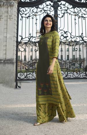 Go With The Shades Of Green With This Designer Readymade Set In Light Green And Olive Green Colored Kurti Paired With Light Green Colored Plazzo. This Readymade Kurti And Plazzo Are Fabricated On Rayon Beautified With Prints And Thread Work. 