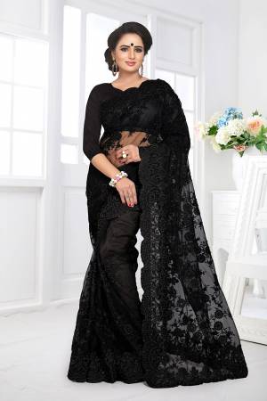 Here Is A Beautiful Heavy Designer Net Fabricated Saree And Blouse. This Saree And Blouse Are Beautified With Heavy Resham Embroidery All Over With Ceramic Stone Work. This Pretty Saree Comes With A Matching Satin Fabricated Inner. Buy This Heavy Designer Saree Now.