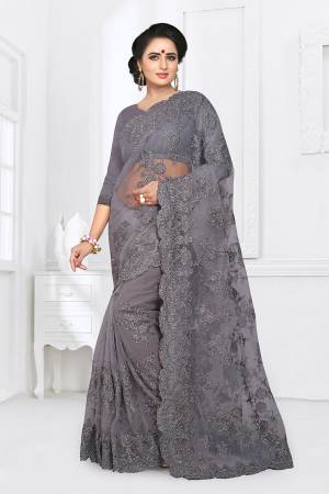 For A Rich, Heavy And Elegant Look, This Heavy Designer Saree Is Perfectly Suitable For All. This Saree And Blouse are Fabricated On Net Beautified With Heavy Resham Embroidery And Ceramic Stone Work. 