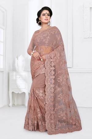 You Will Definitely Earn Lots Of Compliments Wearing This Heavy Designer Saree. This Saree And Blouse Are Fabricated On Net Beautified With Heavy Resham Embroidery With Ceramic Stone Work All Over It. 