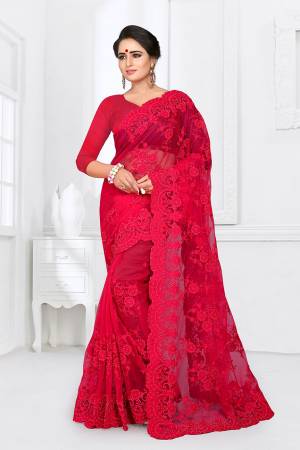 If You Are Fond Of Tone On Tone Embroidery, than This Designer Saree In Perfect For Your. This Heavy Saree And Blouse Are Fabricated On Net Beautified With Tone To Tone Heavy Resham Embroidery With Ceramic Stone Work All Over It. Buy This Saree Now.