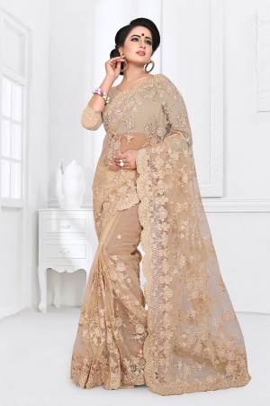 Here Is A Beautiful Heavy Designer Net Fabricated Saree And Blouse. This Saree And Blouse Are Beautified With Heavy Resham Embroidery All Over With Ceramic Stone Work. This Pretty Saree Comes With A Matching Satin Fabricated Inner. Buy This Heavy Designer Saree Now.