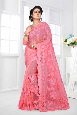 If You Are Fond Of Tone On Tone Embroidery, than This Designer Saree In Perfect For Your. This Heavy Saree And Blouse Are Fabricated On Net Beautified With Tone To Tone Heavy Resham Embroidery With Ceramic Stone Work All Over It. Buy This Saree Now.