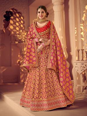 Presenting this magenta and gold color jacquard fabrics and satin lehenga. Ideal for party, festive & social gatherings. this gorgeous lehenga featuring a beautiful mix of designs. Its attractive color and designer heavy embroidered lehenga with jacquard dupatta and fancy blouse, stone design, beautiful floral design work over the attire & contrast hemline adds to the look. Comes along with a contrast unstitched blouse.