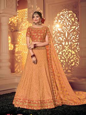 Vibrant and visually appealing, this Peach And Red color jacquard fabrics and satin lehenga. Ideal for party, festive & social gatherings. this gorgeous lehenga featuring a beautiful mix of designs. Its attractive color and designer heavy embroidered lehenga with jacquard dupatta and fancy blouse, stone design, beautiful floral design work over the attire & contrast hemline adds to the look. Comes along with a contrast unstitched blouse.