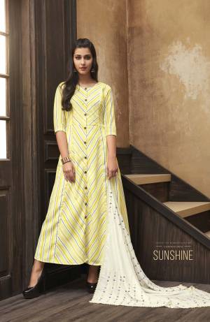 This Festive Season, Celebrate With Beauty And Comfort Wearing This Readymade Kurti In Yellow Color Paired With A Very Pretty White Colored Embroidered Scarf. This Printed Kurti Is Fabricated On Muslin Paired With Rayon Fabricated Scarf. Buy Now.
