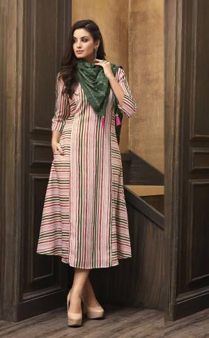 Look Pretty In this Readymade Kurti In Pink Color Paired With Contrasting Dark Green Colored Scarf. This Pretty Kurti Is Fabricated On Muslin Beautified With Lining Prints All Over Paired With Rayon Fabricated Embroidered Scarf.