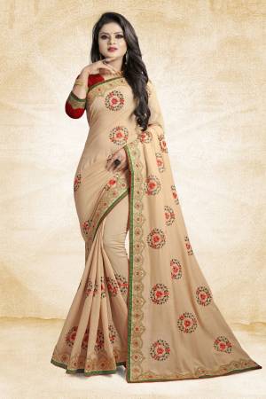 Look Pretty In This Rich And Elegant Looking Designer Saree In Beige Color Paired With Contarsting Maroon Colored Blouse. This Saree And Blouse are Fabricated Silk Beautified With Embroidered Butti Work. Buy This Rich Looking Saree With Pretty Color Pallete Now.