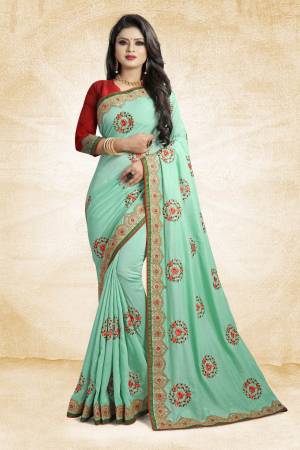 Look Pretty In This Rich And Elegant Looking Designer Saree In Sea Green Color Paired With Contarsting Maroon Colored Blouse. This Saree And Blouse are Fabricated Silk Beautified With Embroidered Butti Work. Buy This Rich Looking Saree With Pretty Color Pallete Now.
