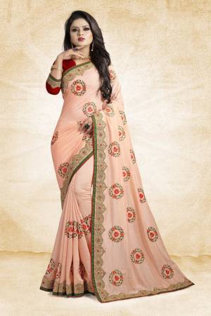 Look Pretty In This Rich And Elegant Looking Designer Saree In Peach Color Paired With Contarsting Maroon Colored Blouse. This Saree And Blouse are Fabricated Silk Beautified With Embroidered Butti Work. Buy This Rich Looking Saree With Pretty Color Pallete Now.