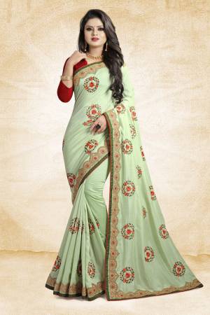 Look Pretty In This Rich And Elegant Looking Designer Saree In Light Green Color Paired With Contarsting Maroon Colored Blouse. This Saree And Blouse are Fabricated Silk Beautified With Embroidered Butti Work. Buy This Rich Looking Saree With Pretty Color Pallete Now.