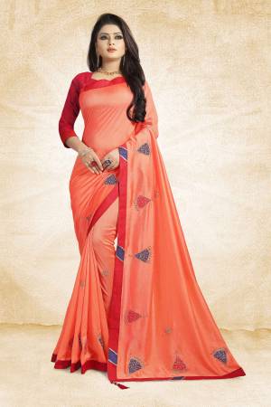 For Your Semi-Casuals, Add This Vibrant Orange Colored Designer Saree To Your Wardrobe Paired With Red Colored Blouse. This Saree And Blouse Are Silk Based Beautified With Simple Butti Work. Grab It Now.