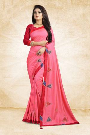 For Your Semi-Casuals, Add This Pretty Pink Colored Designer Saree To Your Wardrobe Paired With Red Colored Blouse. This Saree And Blouse Are Silk Based Beautified With Simple Butti Work. Grab It Now.
