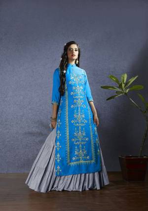New Color Pallete Is Here With This Designer Lehenga Suit In Blue Colored Top And Dupatta Paired With Grey Colored Lehenga. Its Top IS Fabricated On Satin Paired With Muslin Lehenga And Chiffon Based Dupatta. All Its Fabric Ensures Superb Comfort All Day Long. 