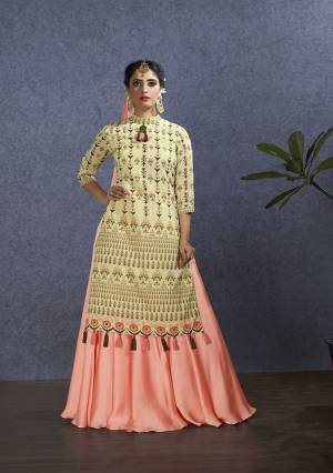 Rich And Elegant Looking Designer Lehenga Suit Is Here In Beige Colored Top Paired With Very Pretty Peach Colored Lehenga And Dupatta. Its Top Is Fabricated On Chanderi Paired With Satin Georgette Lehenga And Chiffon Fabricated Dupatta. Buy This Designer Piece Now.