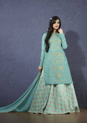 You Will Definitely Earn Lots Of compliments Wearing This Designer Lehenga Suit In Turquoise Blue Colored Top And Dupatta Paired With Light Blue Colored Lehenga., Its Top Is Fabricated On Linen Satin Paired With Jacquard Silk Lehenga And Chiffon Dupatta.