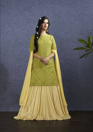 Pretty Shades Are Here With This Designer Lehenga Suit In Pear Green Colored Top Paired With Light Yellow Colored Lehenga And Dupatta. Its Top Is Fabricated On Muslin Paired With Nylon Jacquard Lehenga And Chiffon Fabricated Dupatta. Buy Now.