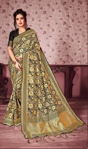 For a Bold And Beautiful Look, Grab This Heavy Woven Designer Silk Based Saree In Black And Gold Color Paired With Black Colored Blouse. This Saree Is Fabricated On Kanjivaram Art Silk Paired With Art Silk Fabricated Blouse. It Is Beautified With Heavy Weave All Over The Saree.