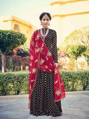 For A Royal And elegant Look, Grab This Heavy Designer Floor Length Suit In Navy Blue Colored Top And Bottom Paired With Dark Pink Colored Dupatta. Its Top Is Fabricated On Viscose Jacquard Paired With Santoon Bottom And Net Fabricated Embroidered Dupatta. Its Rich Color Pallete Will Earn You Lots Of Compliments From Onlookers. 