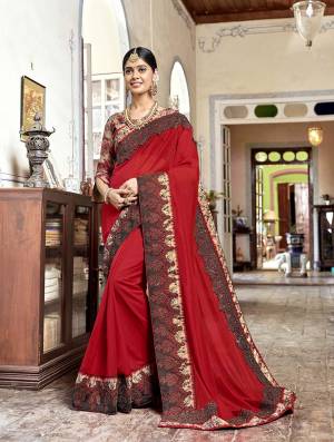 Adorn The Pretty Angelic Look Wearing This Designer Saree In Red Color Paired With Multi Colored Blouse. This Saree Is Fabricated On Silk Georgette Paired With Satin Silk Fabricated Printed Blouse. 