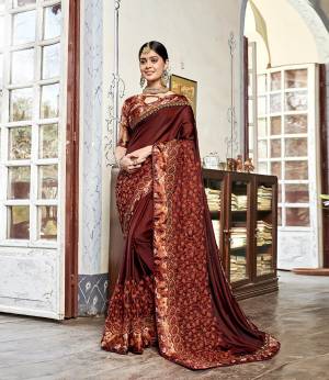 New Pattern With Hevy Look Designer Saree Is Here In Brown Color Paired With Brown Colored Blouse. This Saree IS Fabricated On Satin Silk Paired With Satin Silk Fabricated Printed Blouse. Buy This Saree Now.