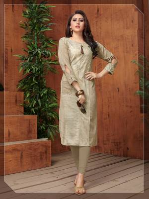 Flaunt Your Rich And Elegant Taste In This Rich Looking Readymade Kurti In Beige Color Fabricated On Khadi Cotton. It Is Beautified With Lining Prints Which Is Giving An Elegant Look Overall. 