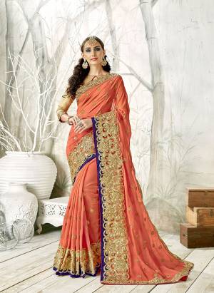 Grab This Heavy Designer Saree In Attractive Dark Peach Color Paired With Golden Colored Blouse. This Saree IS Fabricated On Georgette Paired With Art Silk Fabricated Blouse. It Is Beautified With Heavy Embroidery. Buy Now.