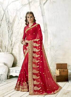 Adorn The Pretty Angelic Look Wearing This Designer Saree In Red Color Paired With Red Colored Blouse. This Saree Is Fabricated On Chiffon Paired With Art Silk Fabricated Blouse. It Has Heavy Jari Work All Over. 