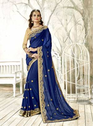 Grab This Heavy Designer Saree In Attractive Royal Blue Color Paired With Beige Colored Blouse. This Saree IS Fabricated On Georgette Paired With Art Silk Fabricated Blouse. It Is Beautified With Heavy Embroidery. Buy Now.