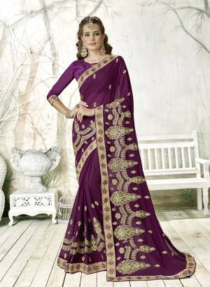 Adorn The Pretty Angelic Look Wearing This Designer Saree In Purple Color Paired With Purple Colored Blouse. This Saree Is Fabricated On Georgette Paired With Art Silk Fabricated Blouse. It Has Heavy Jari Work All Over. 