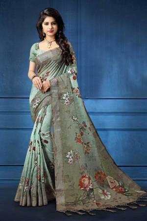 Grab This Pretty Printed Saree For Your Semi-Casuals. This Saree And Blouse Are Fabricated On Linen Beautified With Digital Prints All Over It, This Saree Is Light In Weight And Easy To Carry All Day Long. 