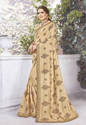Rich And Elegant Looking Designer Saree Is Here In Beige Color Paired With Beige Colored Blouse. This Saree And Blouse are Silk fabricated Beautified With Thread Embroidery And stone Work .It Is Light Weight And Easy To carry All Day Long. 