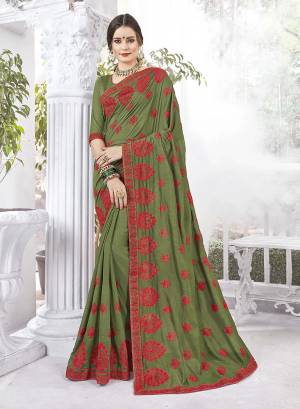 Look Beautiful Wearing This Designer Saree In Olive Green Color Paired With Oliev Green Colored Blouse. This Saree And Blouse Are Fabricated Vichitra Silk And Art Silk Respectively. It Is Easy To Drape, Durable And Easy To Care For.