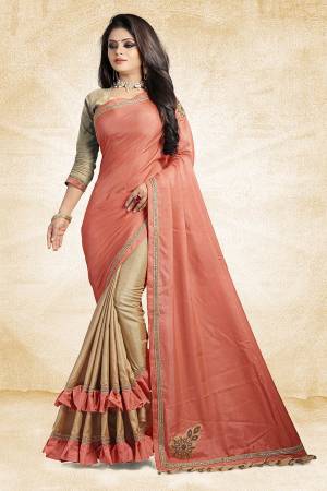 For A Rich And Elegant Look, Grab This Designer Saree In Peach And Beige Color Paired With Beige Colored Blouse. This Saree And Blouse Are Silk Based Beautified with Embroidered Patch Work And Lace Border. Buy Now.