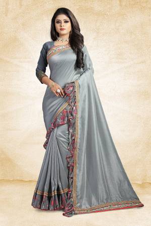 Look Pretty Wearing This Designer Silk Based Saree In Grey Color Paired With Grey Colored Blouse. This Saree And Blouse Are Silk Based Beautified With Lace Border And Printed Frill Over The Border. Buy This Pretty Saree Now.