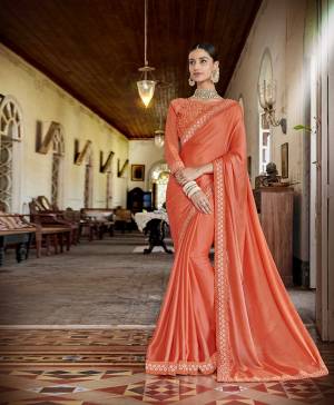 Celebrate This Festive Season With Beauty And Comfort Wearing This Designer Saree In Orange Color Paired With Orange Colored Blouse. This Saree Is Fabricated On Satin Chiffon Paired With Art Silk Fabricated Blouse. It Is Beautified With Coding And Thread Embroidery In Tone To Tone Shade. 
