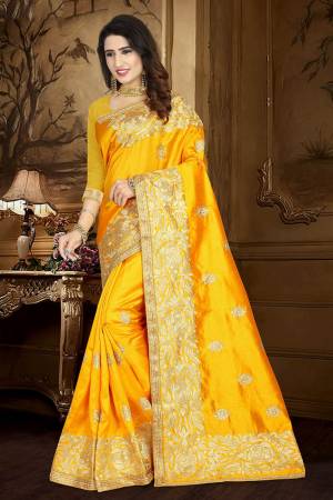 Celebrate This Festive Season Wearing This Rich Silk Based Saree In Yellow Color Paired With Yellow Colored Blouse. This Saree And Blouse Are Fabricated On Art Silk Beautified With Embroidery And Lace Border. 